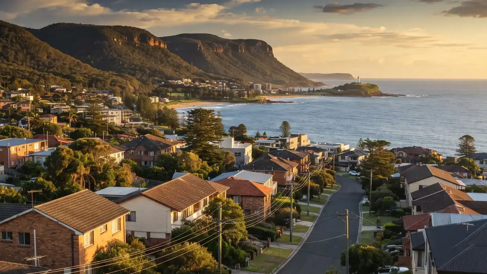 Aerial view of Wollongong's coastline and residential streets below the Illawarra escarpment
